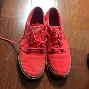 Red Nike skate shoes